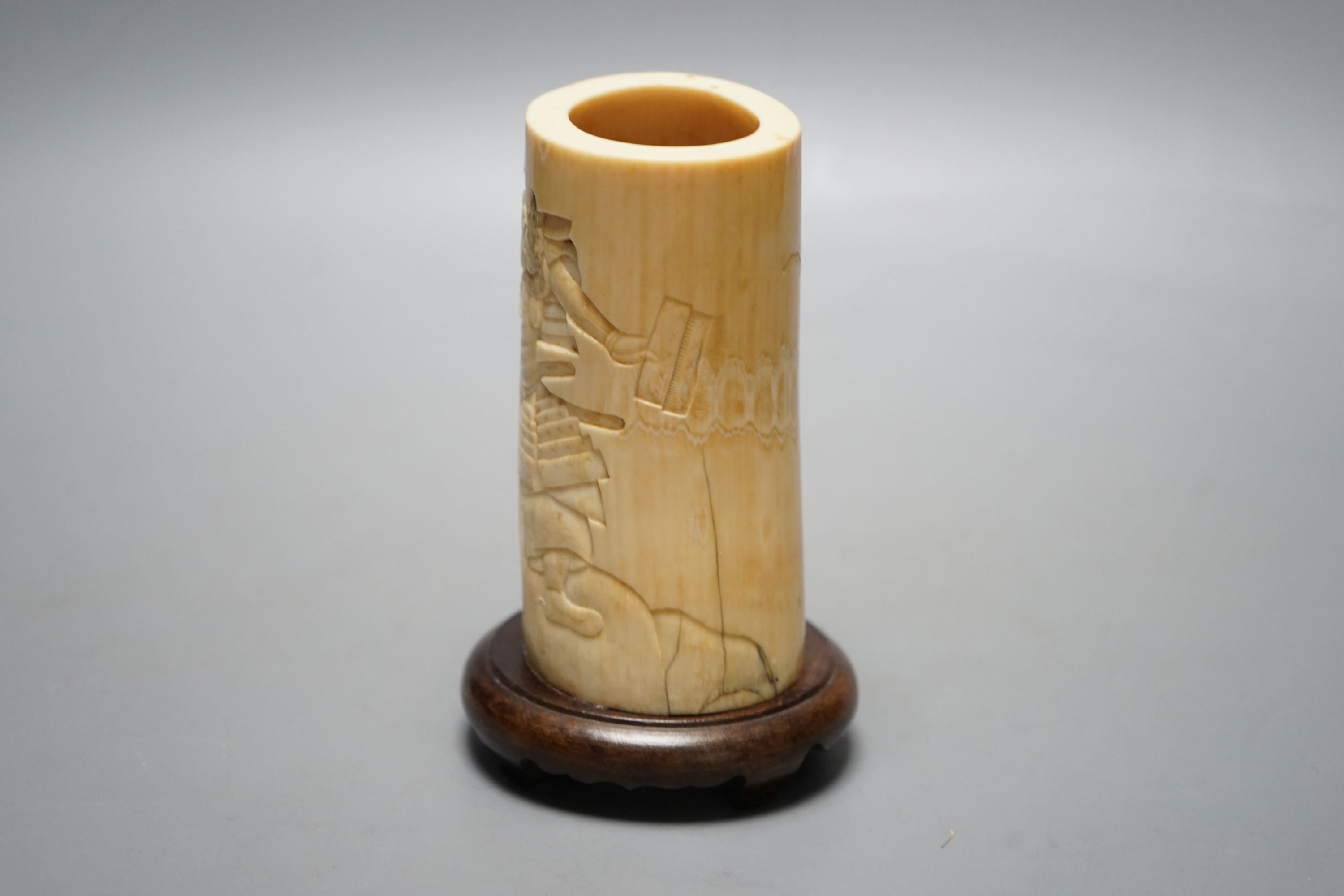 A Japanese Meiji period brush pot with samurai, 23 cms high including stand.